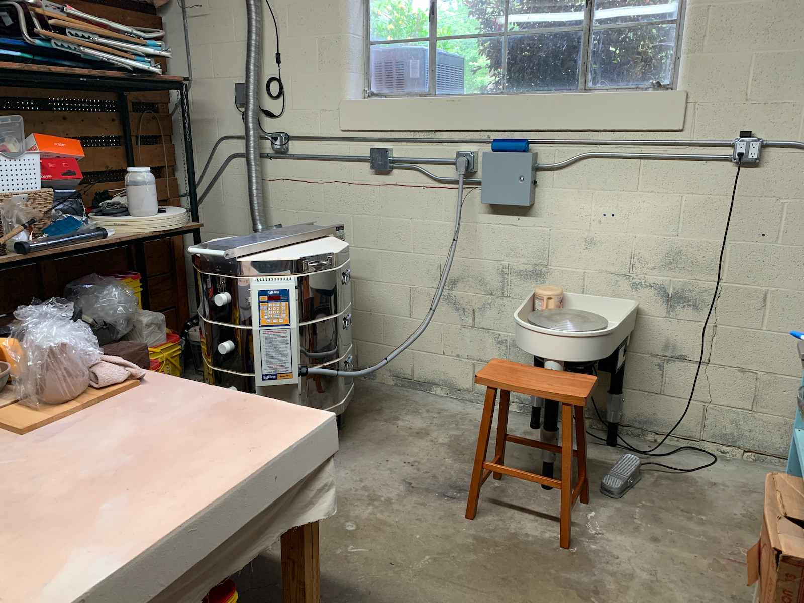 Studio with pottery wheel and kiln